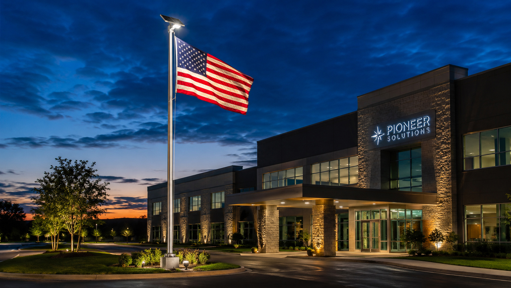 Commercial building with solar flagpole lighting at evening