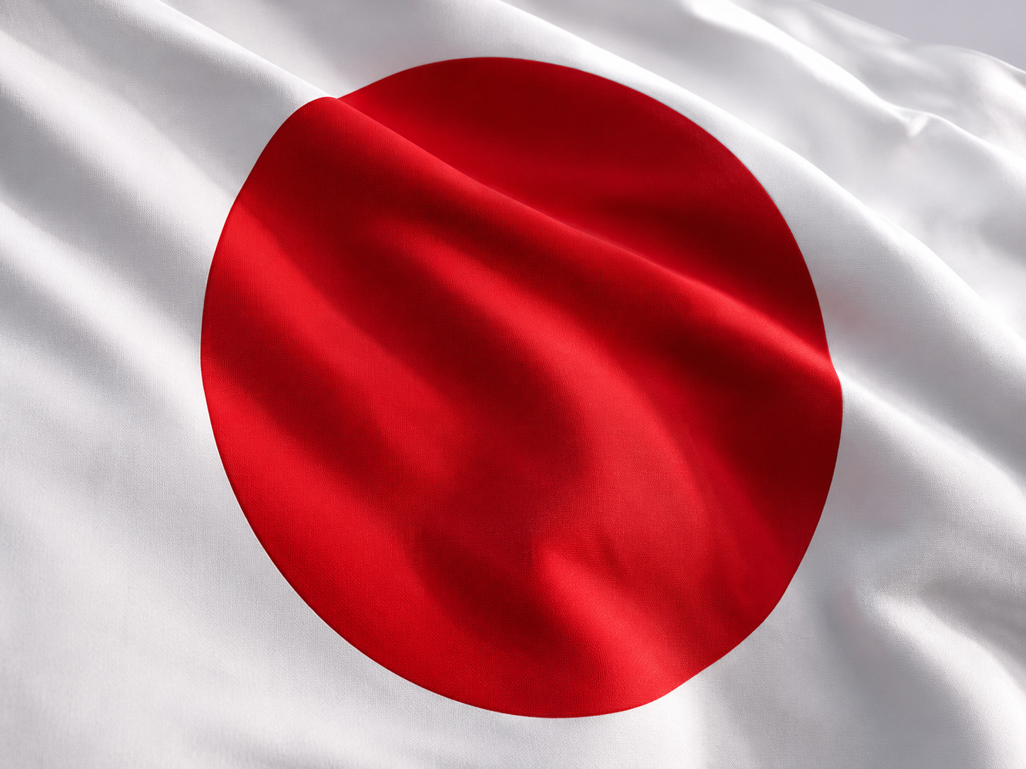 Closeup of Japanese Hinomaru flag showing red sun on white field